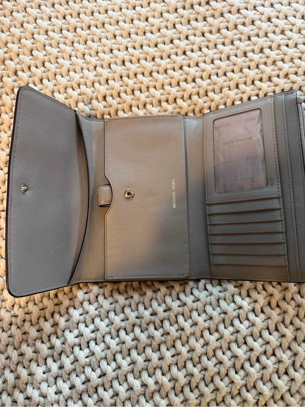 Michael Kors Gray Trifold Leather Men's Wallet with Card Slots stain in the back